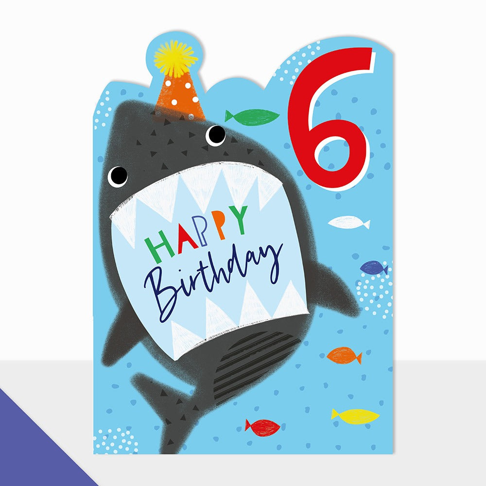 "Happy 6th Birthday" Age card from Laura Darrington Design featuring an snappy shark.  Produced a die cut top edge.